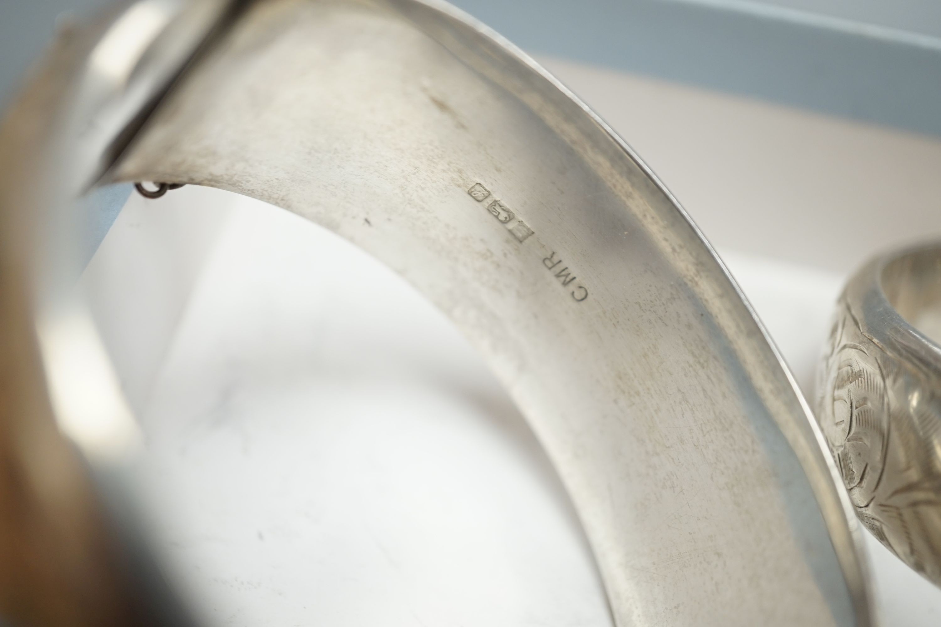 A Victorian silver bangle, Birmingham, 1885 and five later silver bangles.